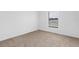 Bedroom featuring neutral carpet, white walls, and a bright window at 4831 Hillman Ter, North Port, FL 34288