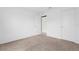 A bedroom with neutral carpet and white walls at 4831 Hillman Ter, North Port, FL 34288