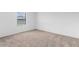 Bright bedroom with neutral carpet and natural light from the window at 4831 Hillman Ter, North Port, FL 34288