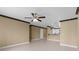 Bright, airy living area with tile flooring and decorative trim, flowing into the kitchen at 4831 Hillman Ter, North Port, FL 34288