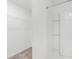 Walk-in shower with shelving and neutral carpet at 4831 Hillman Ter, North Port, FL 34288
