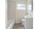 Bright bathroom featuring a tiled shower, sink, and granite floors at 4925 Murray Hill Dr, Tampa, FL 33615