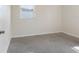 Empty bedroom featuring polished concrete floors, window, and neutral paint at 4925 Murray Hill Dr, Tampa, FL 33615