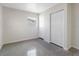 Bedroom featuring polished concrete floors, closet, and window at 4925 Murray Hill Dr, Tampa, FL 33615