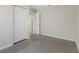 Cozy bedroom featuring polished concrete floors, closet, and neutral paint at 4925 Murray Hill Dr, Tampa, FL 33615