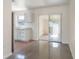 Bright kitchen with a stainless steel refrigerator open to sunroom area at 4925 Murray Hill Dr, Tampa, FL 33615