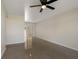 Spacious living room with neutral wall color and shiny floor next to sliding glass doors at 4925 Murray Hill Dr, Tampa, FL 33615
