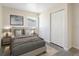 Comfortable bedroom with polished concrete floors, closet, window, lamps and queen bed at 4925 Murray Hill Dr, Tampa, FL 33615