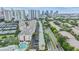 Panoramic aerial shot showcasing residential condos, green landscaping, city skyline and a community pool at 501 Knights Run Ave # 6104, Tampa, FL 33602