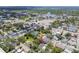 Aerial view of neighborhood home, showcasing its location and proximity to a pond and the city at 527 Bay St, Dunedin, FL 34698