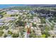 An aerial view showcases the neighborhood and surrounding area, highlighting the proximity to the water and local amenities at 527 Bay St, Dunedin, FL 34698