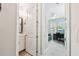 A half bath is visible and an office with a window, desk, and sofa creates a flexible workspace at 527 Bay St, Dunedin, FL 34698