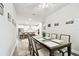 Dining room leading to a modern kitchen with bar seating at 527 Bay St, Dunedin, FL 34698