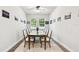 Bright dining room features a wood table, six chairs, and neutral decor at 527 Bay St, Dunedin, FL 34698