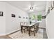 Dining room with wood table, neutral chairs, and modern decor at 527 Bay St, Dunedin, FL 34698