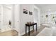 Hallway with stylish décor leading to laundry room and other living areas at 527 Bay St, Dunedin, FL 34698
