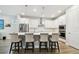 Well-appointed kitchen featuring a large island, modern appliances, and pristine white cabinetry at 527 Bay St, Dunedin, FL 34698