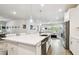 Spacious kitchen with white cabinetry, stainless steel appliances, and island at 527 Bay St, Dunedin, FL 34698