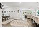 Inviting living space featuring a dining area and a kitchen with an island, fostering seamless interaction and comfort at 527 Bay St, Dunedin, FL 34698
