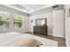 Main bedroom with hardwood floors and a large dresser with plenty of storage space at 527 Bay St, Dunedin, FL 34698