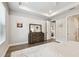 Spacious main bedroom with natural light and modern furnishings with an adjoining open doorway at 527 Bay St, Dunedin, FL 34698