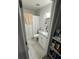 Bathroom featuring modern fixtures, granite vanity, updated flooring, and a tiled shower at 601 N Hercules Ave # 1008, Clearwater, FL 33765