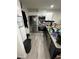 Modern kitchen features stainless steel appliances, granite countertops, and ample cabinet space at 601 N Hercules Ave # 1008, Clearwater, FL 33765
