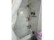 Updated shower area with modern hardware, a rainfall shower head, and tiled wall design at 601 N Hercules Ave # 1008, Clearwater, FL 33765