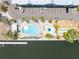 Overhead view of community pool, shuffleboard, and waterfront access at 611 Destiny Dr # 509, Ruskin, FL 33570