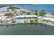 Aerial view showcases the building, pool, beach and surrounding waterfront at 611 Destiny Dr # 509, Ruskin, FL 33570