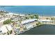 Wide aerial view of the waterfront condos with pool, beach, pier, and surrounding scenic views at 611 Destiny Dr # 509, Ruskin, FL 33570