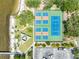 Overhead view featuring community courts, parking and shaded recreation area, set alongside the water at 611 Destiny Dr # 509, Ruskin, FL 33570