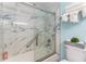 Modern bathroom with white and blue marble tile surround at 611 Destiny Dr # 509, Ruskin, FL 33570