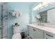 Charming bathroom featuring a white vanity, framed mirror, and modern fixtures at 611 Destiny Dr # 509, Ruskin, FL 33570