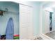 Bright closet with sliding door featuring storage shelves and an ironing board at 611 Destiny Dr # 509, Ruskin, FL 33570