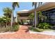 Inviting entryway with brick pavers and tropical foliage leading to the building at 611 Destiny Dr # 509, Ruskin, FL 33570