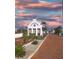 Charming view of the Little Harbor entrance with lovely landscaping and well-maintained brick road at 611 Destiny Dr # 509, Ruskin, FL 33570