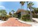 Beautiful building surrounded by lush greenery, with a brick walkway at 611 Destiny Dr # 509, Ruskin, FL 33570