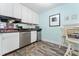 Kitchen featuring stainless steel appliances, white cabinetry, and dark countertops at 611 Destiny Dr # 509, Ruskin, FL 33570