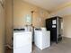 Bright community laundry room featuring washers, dryers, and vending machine at 611 Destiny Dr # 509, Ruskin, FL 33570