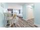 Open living area with dining space, twin beds, and coastal-inspired decor at 611 Destiny Dr # 509, Ruskin, FL 33570