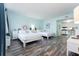 Bright main bedroom with two beds, TV and partial kitchen view at 611 Destiny Dr # 509, Ruskin, FL 33570