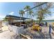 Outdoor seating area featuring picnic tables, a bar, and scenic waterfront views at 611 Destiny Dr # 509, Ruskin, FL 33570