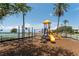 Fun playground area featuring slides and climbing equipment on a vibrant sunny day at 611 Destiny Dr # 509, Ruskin, FL 33570