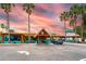 Vibrant restaurant entrance showcasing colorful architecture, palm trees, and convenient parking at 611 Destiny Dr # 509, Ruskin, FL 33570