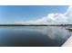 Scenic waterfront view reflecting the blue sky and clouds, showcasing the calm and serene water at 611 Destiny Dr # 509, Ruskin, FL 33570