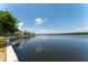 Picturesque waterfront view reflecting the clear blue sky and scattered clouds on a sunny day at 611 Destiny Dr # 509, Ruskin, FL 33570