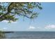 Beautiful waterfront scene featuring a pier extending into the calm ocean under a clear sky at 611 Destiny Dr # 509, Ruskin, FL 33570