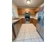 Well-lit kitchen with stainless steel appliances and ample cabinet space at 6333 Maisie Rd, Zephyrhills, FL 33542