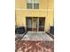 View of the screened patio with tile flooring, ceiling light, and access doors at 6333 Maisie Rd, Zephyrhills, FL 33542